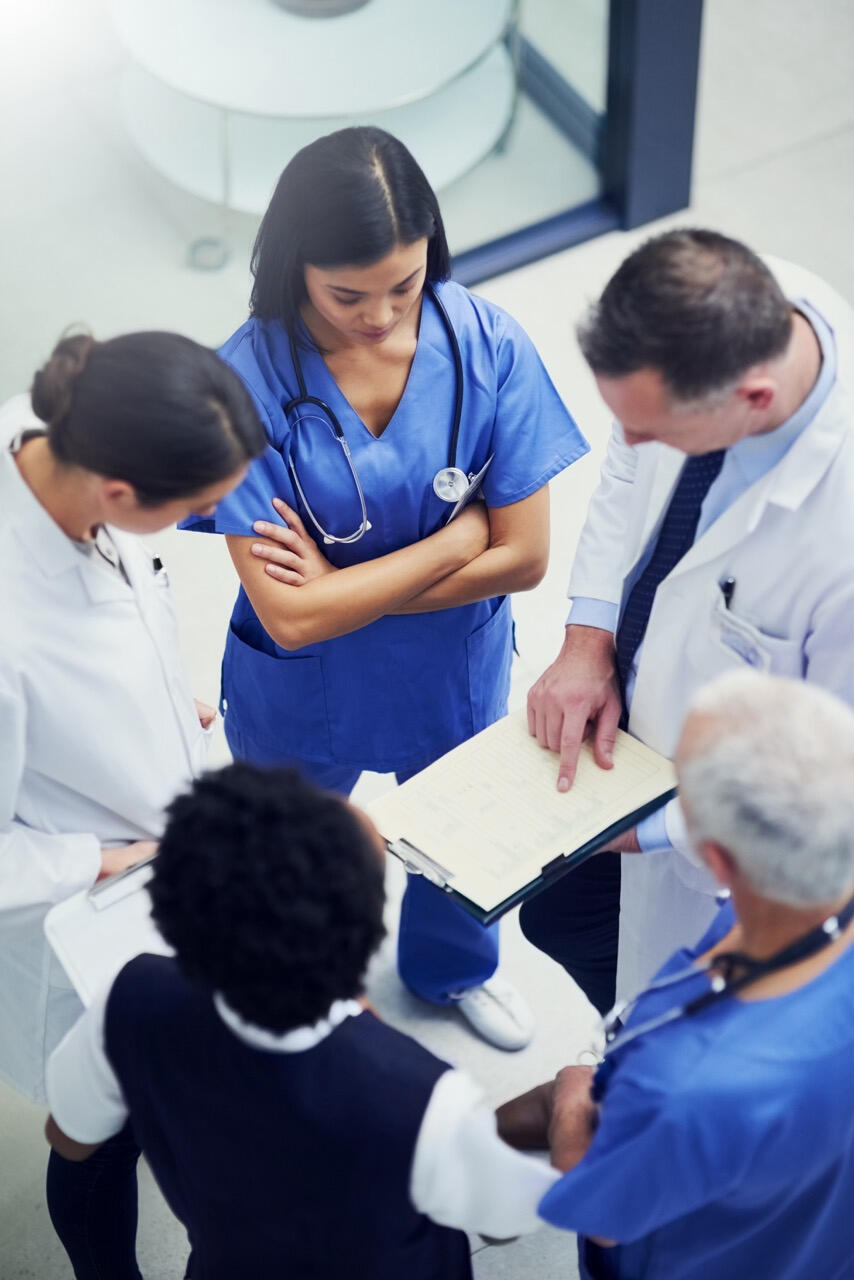 Senior smiling patients with smiling doctor.